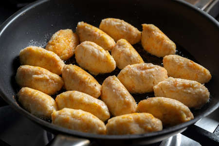 Dumplings in a frying pan. An old Russian dish otluchentsy or kartoflanikiの写真素材