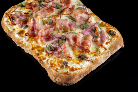 Pizza with capers, bacon and red onions.の写真素材