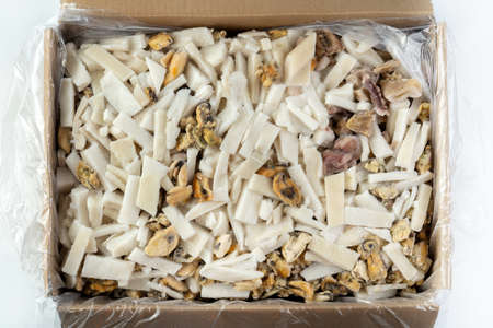 Mixed of frozen chilled seafood in a cardboard box. The main composition of the sliced squid.の写真素材
