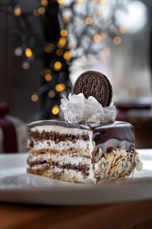 Cake with chocolate cookies and whipped cream. Drizzled with chocolate.の写真素材