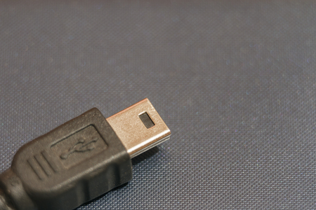 Micro USB connector for connecting to smartphone. There is space for text