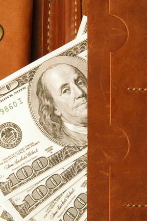 Hundred dollars bill in leather wallet, close up. Financeの写真素材