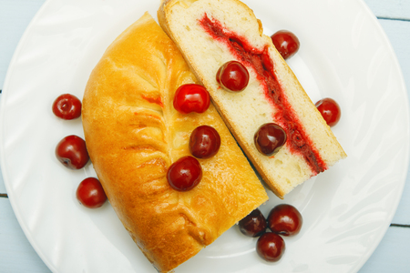 Fruit pie closeup. Scattered berries. Natural vegetarian food concept. Top viewの写真素材