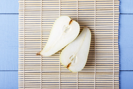 Sliced pears on bamboo mat. Chinese and japanese food concept.の写真素材