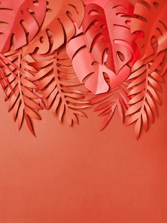 Set of amazing leaves made of craft paper lying on living coral background. Color of 2019.の写真素材
