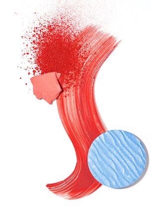 Beauty and makeup products flat lay. Spills and smears of red lipstick, blush,  broken coral pink and blue eyeshadows isolated on white background. Beauty, professional eye and lip makeup, fashion concept.の写真素材