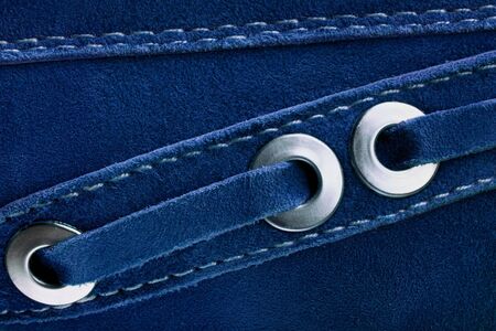close up image of suede shoes toned in trendy blue color. Textile texture. Classic blue background. Color of the year 2020. Main color trend concept.の写真素材