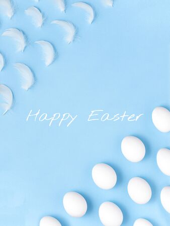 Diagonally oriented rows of fluffy white feathers and chicken eggs. Easter Holiday mood. Purity and lightness concept background.の写真素材