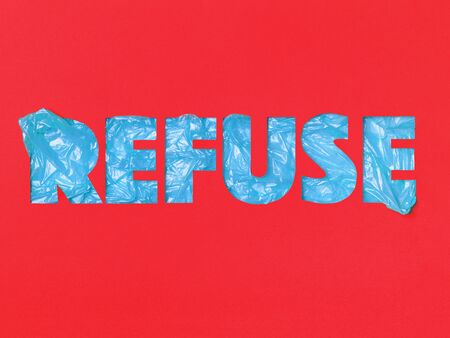Slogan REFUSE on an red  made in paper cut technique.の写真素材