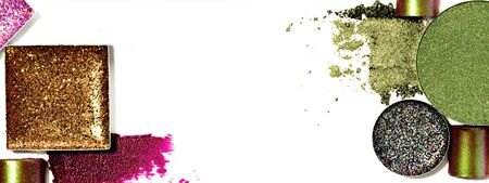 Still life of makeup products isolated on a white background. Abstract composition of smudged and scattered makeup texture. Closeup of colourful beauty products for makeup artists busyness design.の写真素材
