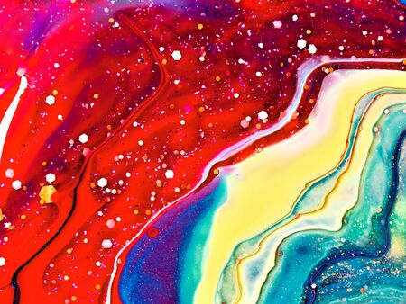 Close-up fragment of acrylic texture with marble pattern. Liquid paint background. Colourful mix of vibrant colours. Abstract art wallpaper.の写真素材