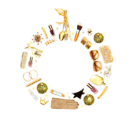 Christmas gifts idea. Presents for her laid as a New Year Wreath symbol. Feminine accessories and cosmetics isolated on white. Christmas round frame for cards, invitations, banners. Space for text.の写真素材