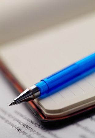 Closeup note pad and penの写真素材