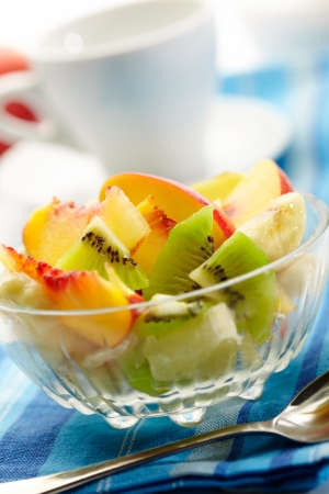 fruit salad with a cup on backgroundの写真素材
