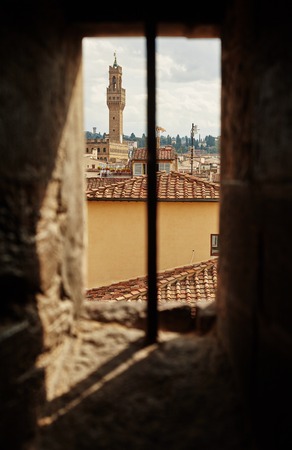 Beautiful view, through the old window on Palazzo Vecchioの写真素材