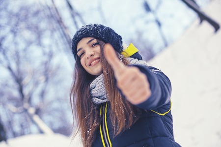 Beautiful young woman in winterの写真素材