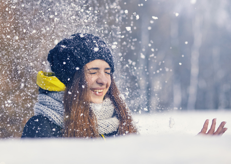 Beautiful young woman in winterの写真素材