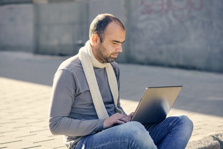 man with the laptop computer outdoorsの写真素材