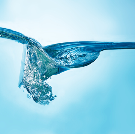 Close-up picture of abstract water wave with bubbles.の写真素材