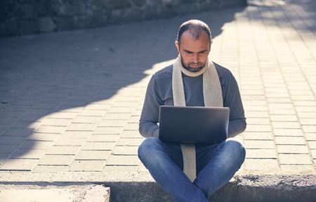 man with the laptop computer outdoorsの写真素材