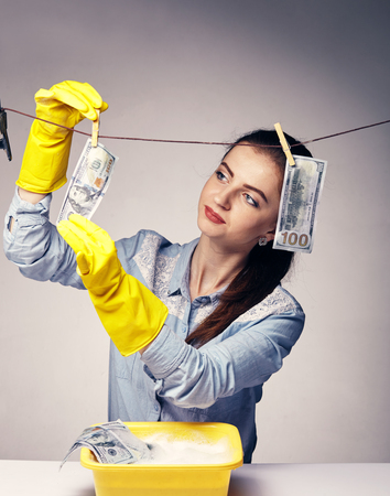 conceptual image on which the woman launder shady moneyの写真素材