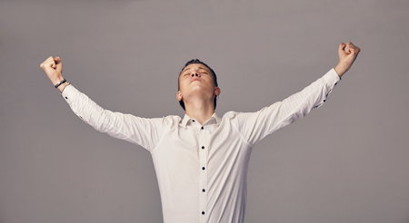 man demonstrates a sign of successの写真素材