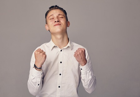 man demonstrates a sign of successの写真素材