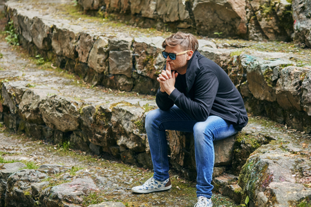 depressed young man is worried about somethingの写真素材