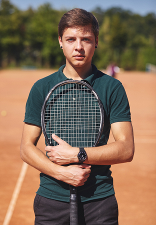 a Tennis player holding racket and in handsの写真素材