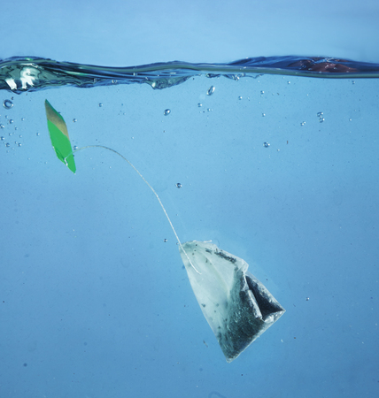 tea bag as a symbol of pollution in the ocean