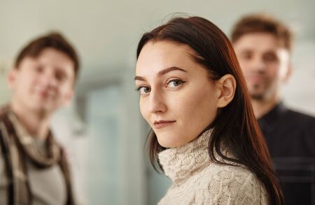 beautiful woman on the background of business peopleの写真素材