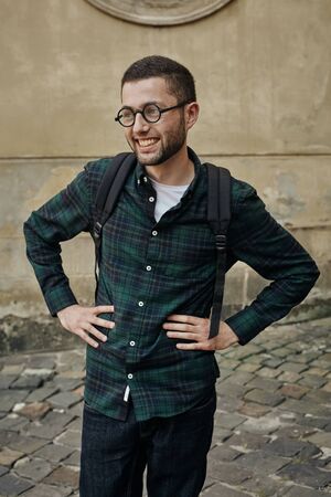 Portrait of adult man wearing glasses