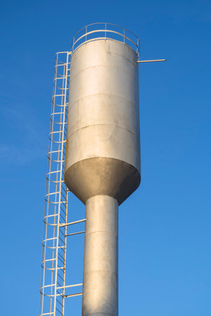 Water tower on a background of blue clear skyの写真素材