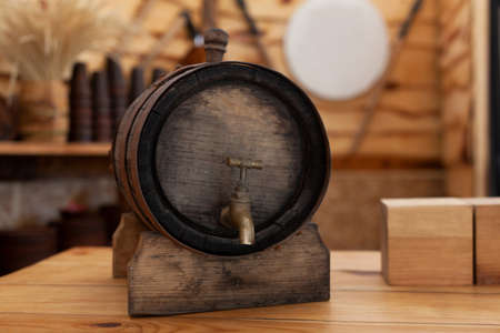 Old wooden barrel of beer with a tap onの写真素材