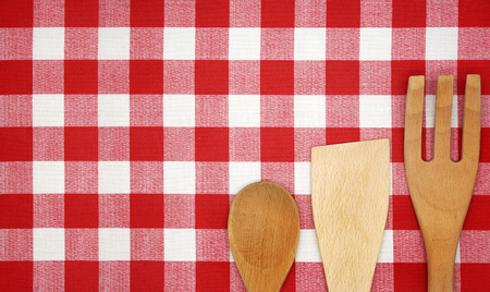 Wooden Cooking Utensils on a Red Checkered Tableclothの写真素材