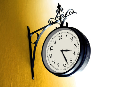 Vintage Clock on a Yellow Wall - Daylight Saving Time