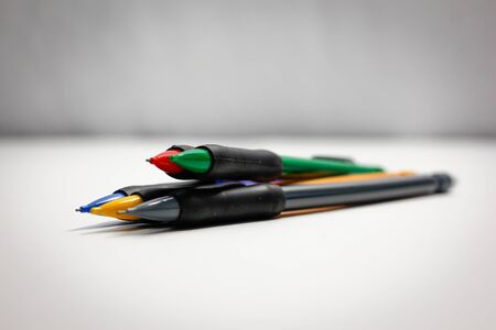 different colored pencils on a white backgroundの写真素材