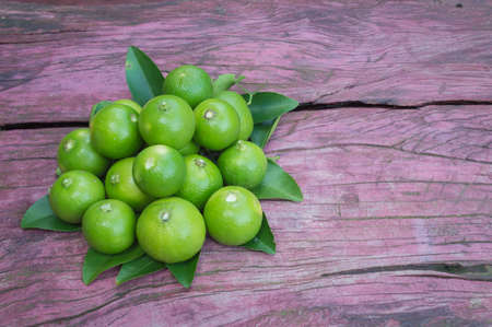 Lime close up on wooden table 