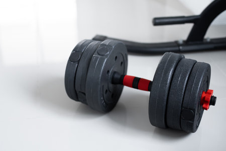 Dumbbells on empty floor in home