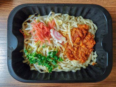 A dish of Japanese ramen noodles with pickled ginger and spicy pork.の写真素材