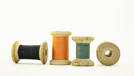 group wood spool of sewing thread isolated on white. Close-up macro shot.の写真素材