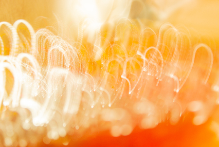 Blurred background, glow like electricity or lightning. Bright yellow lightsの写真素材