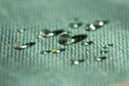 water drops on waterproof textile material. Water repellent cloth tableclothの写真素材