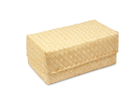 basket of sugar palm leaf on whiteの写真素材