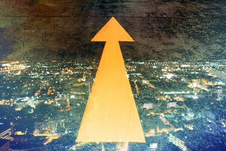 Abstract Light with Arrow direction to goal, success  Direction Arroww with night city background.の写真素材