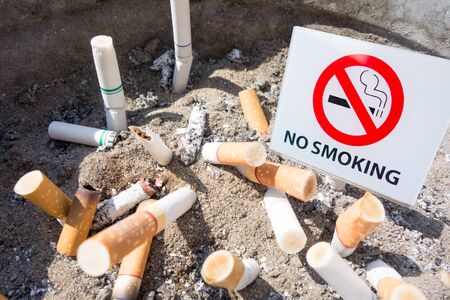 no smoking sign with cigarette backgroundの写真素材