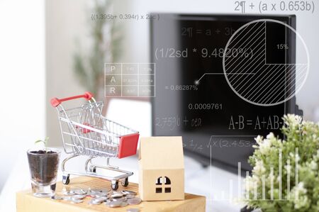 shopping online concept :Shopping Cart onthe box with paper home mock up. Shooping online delivery at home.Work desk blur background.Copyspace for text. nobody.Online Delivery. の写真素材