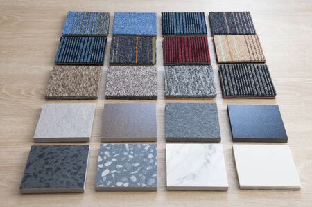 Sample of carpets and Ceramic tiles on wood background. Carpet and Cramic tiles materials use for Interio designer. Home construction decorate room with luxury Carpets and Ceramics set.の写真素材