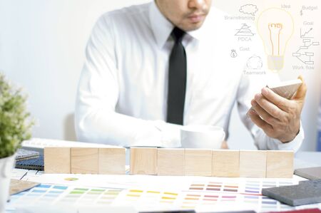 Interior design holding stone material for idea. wood material on the table for text. Idea concept for home desig from material. Copyspace for text.の写真素材