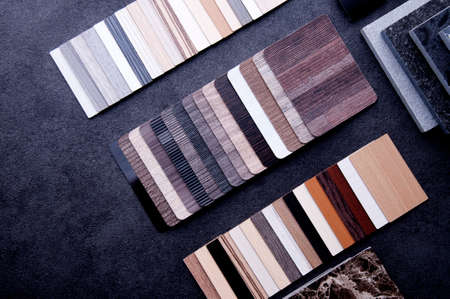 Materials Concept. Top view of wood laminate materials on wooden floor. Interior materials design...